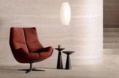 modern interior with a burnt orange swivel chair, black side tab